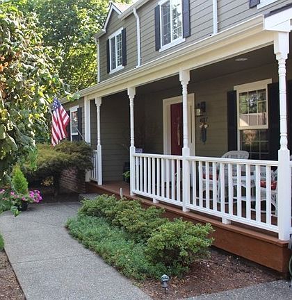 Inviting front porch offers a nice place to sit and sip your ice tea or chat with a neighbor walking by.