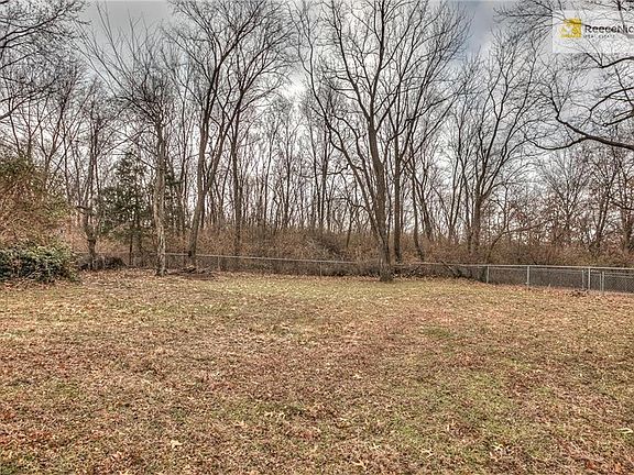 No neighbors behind you!!!  What a bonus!  The yard is fenced.  There is a space set up for a firepit in the back corner.