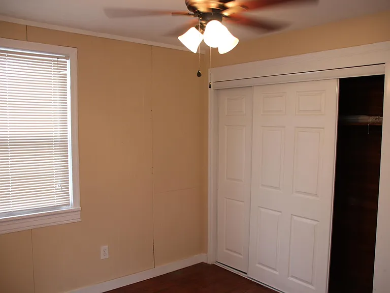 Refinished hardwood flooring, new windows and stylish ceiling fans.