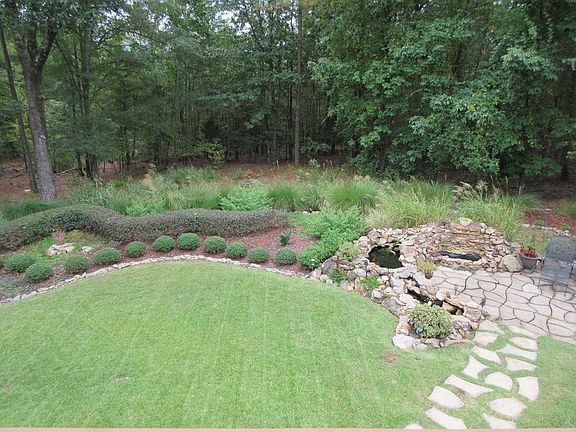 Backyard,Coi pond, patio
						:
						Landscaping, sprinkler system, pond & patio
