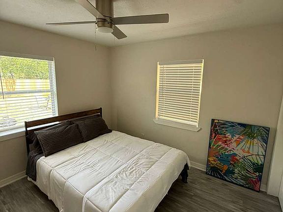 Stylishly furnished private bedroom with queen bed