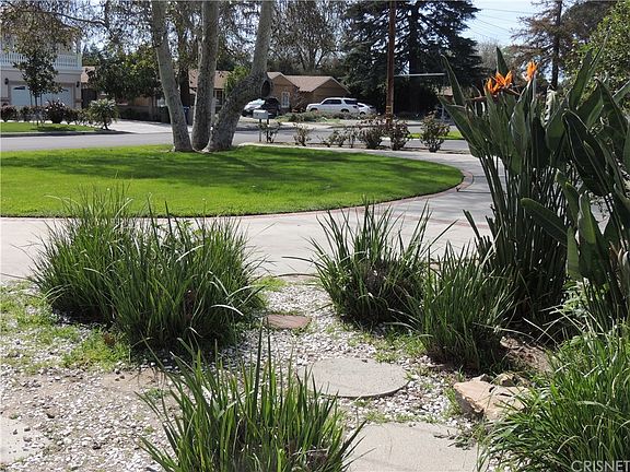 View of front lawn and neighborhood from East fron