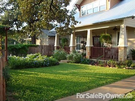 Front of House
						:
						Amazing spring and summer flowers and a very large porch with three ceiling fans