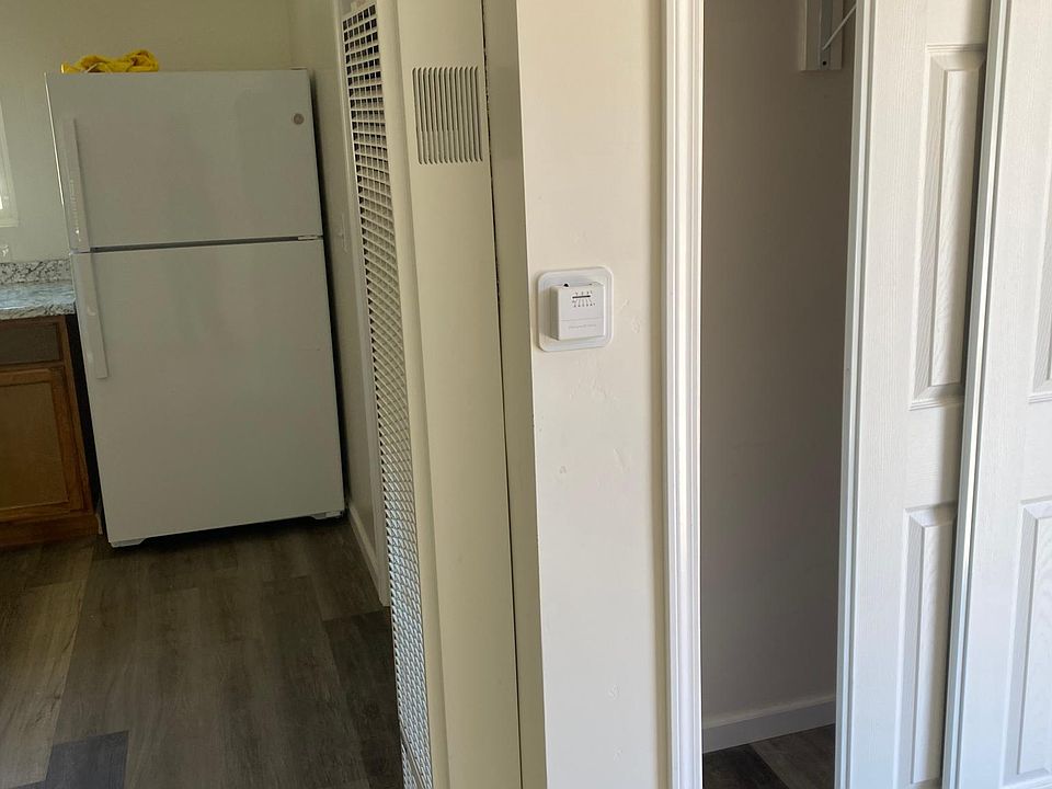 closet, around the corner is bathroom door.