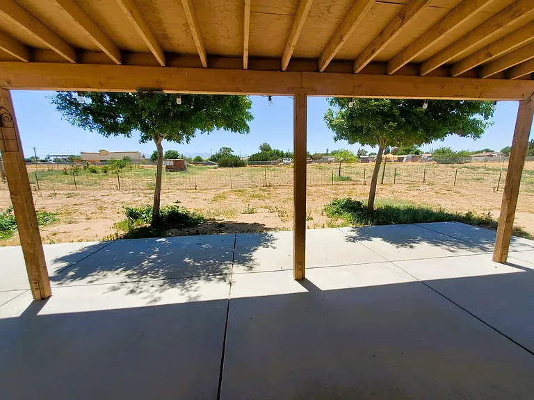 Mature shade trees extend patio shade.