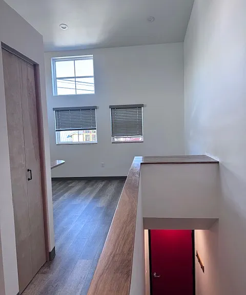 standing by bathroom looking into front room