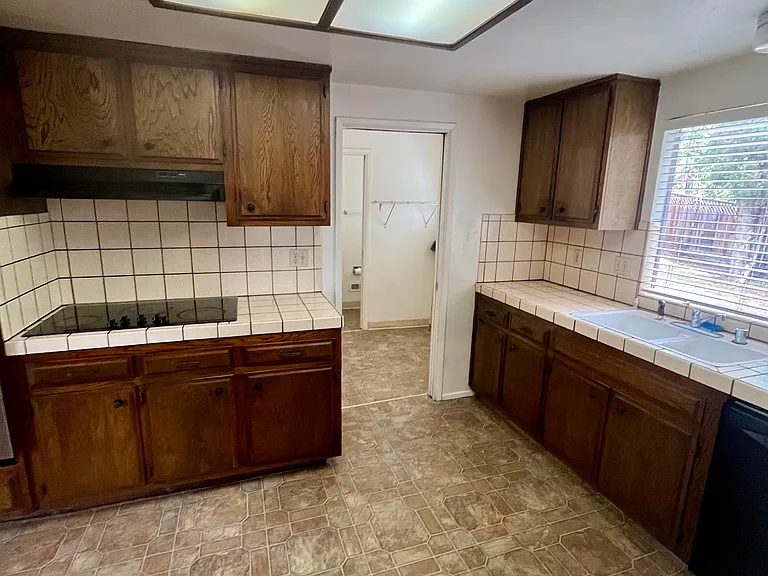 A spacious kitchen with ample storage.
