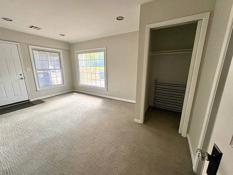 Primary bedroom with closet and bathroom