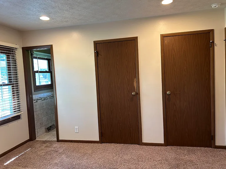 master bedroom with two closets