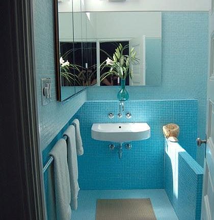 Spa-like bathroom with glass mosaic tile, sky-light, soarin