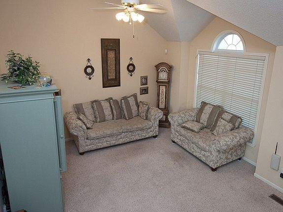 Relax in your lovely Great Rm, w/tall ceilings, ceiling fan & tons of light!