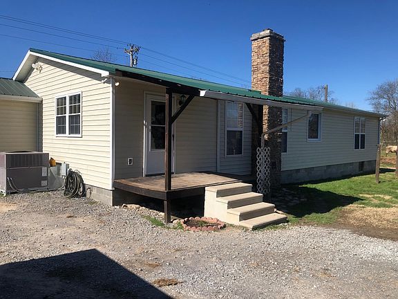Back of house, entry into mudroom/laundry