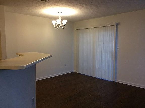 Dining area w/ eat-in counter, & access to patio