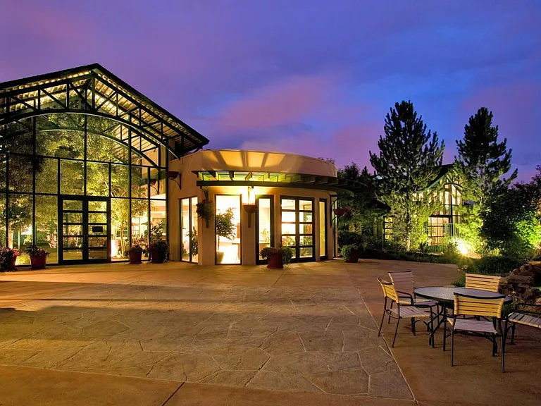 Night view-Entrance to clubhouse and amenities-Directly across street from property.