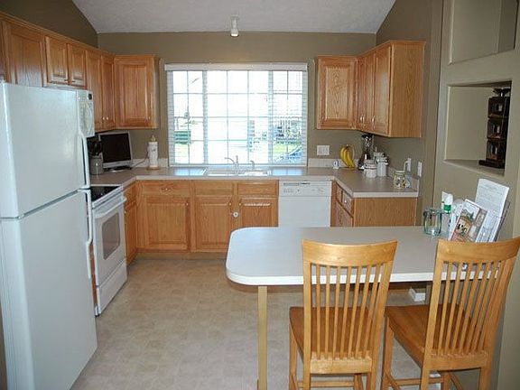 Kitchen with breakfast bar and pantry