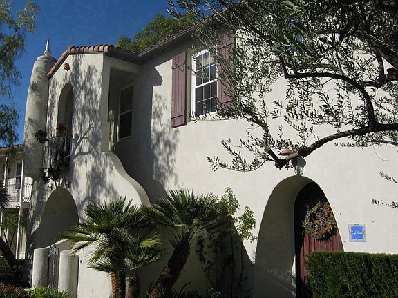 Gated entry to the 2nd floor apartment - bedroom window with