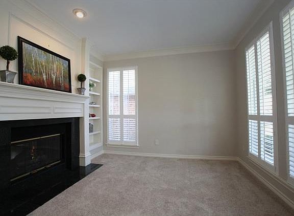 Formal Living has Crown Moulding, Plantation Shutters, See-thru FP & Built-in Bookcase!