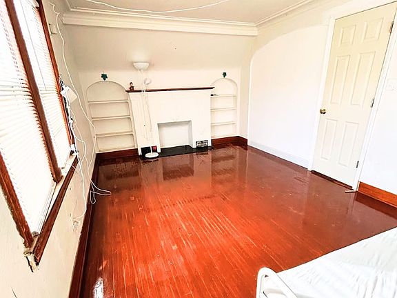 Large sun-filled bedroom featuring two street-facing windows for excellent natural light and airflow. Includes a spacious walk-in closet and beautifully refinished hardwood floors. A comfortable and versatile space perfect for a bedroom, or a family area.