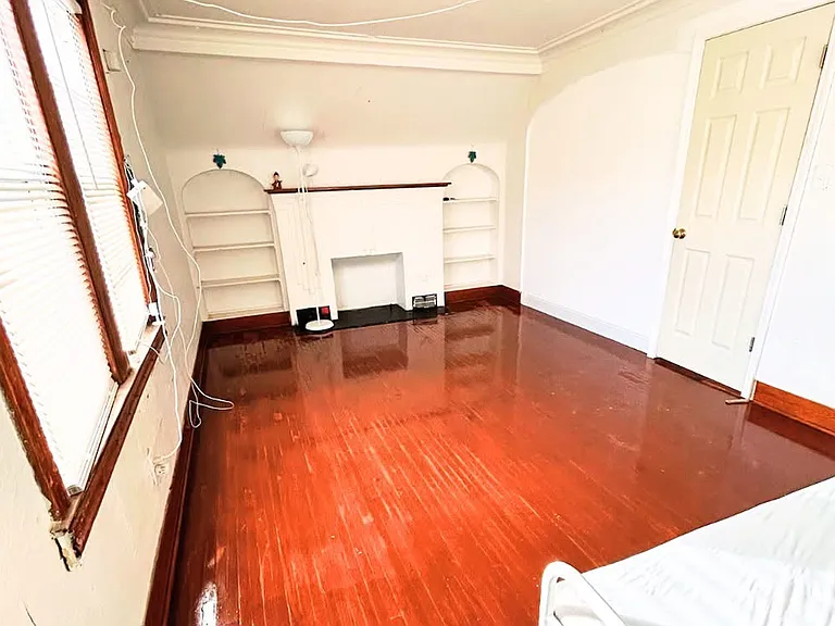 Large sun-filled bedroom featuring two street-facing windows for excellent natural light and airflow. Includes a spacious walk-in closet and beautifully refinished hardwood floors. A comfortable and versatile space perfect for a bedroom, or a family area.