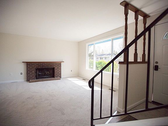 Main floor: Living room with tons of light and brand new carpet.