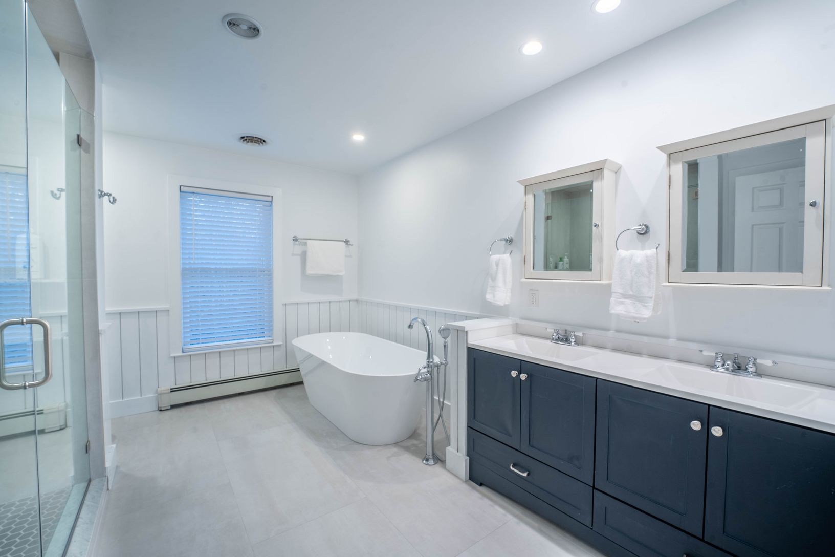  newly renovated master en suite bath with large shower, large soaking tub, and heated floors