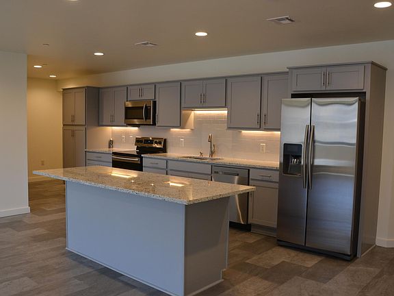 Galley style kitchen with granite counter tops, great storage space and all new appliances.