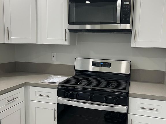New cabinets and stove, microwave