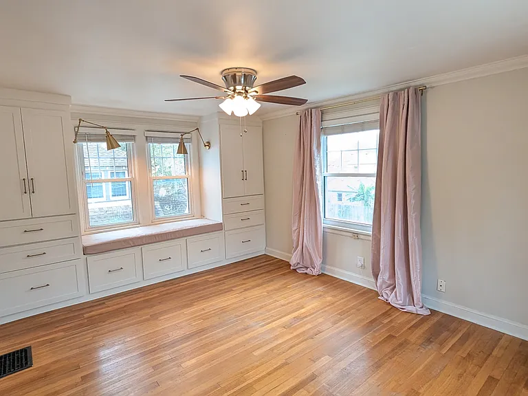 bedroom with custom built-ins and cushion
