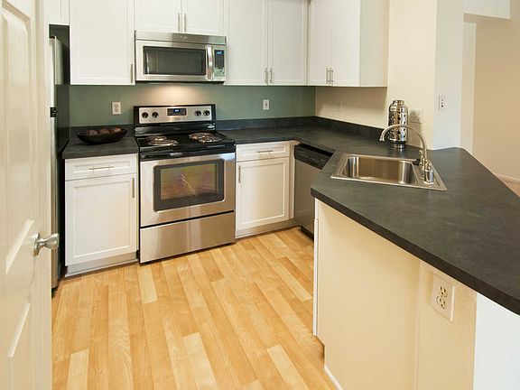 Upgraded Kitchen with Stainless Steel Appliances and White C