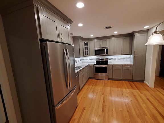 New Custom Kitchen, including appliances. Bottom freezer frig.