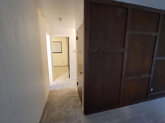 to bedrooms/bathroom from living area