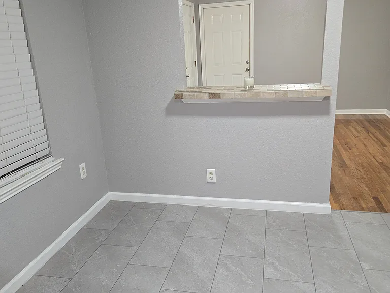 Dining Area with opening to Living Room.. Brand new floors