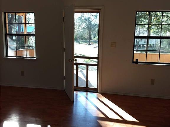Large front porch allows you to enjoy the nature surrounding this home.