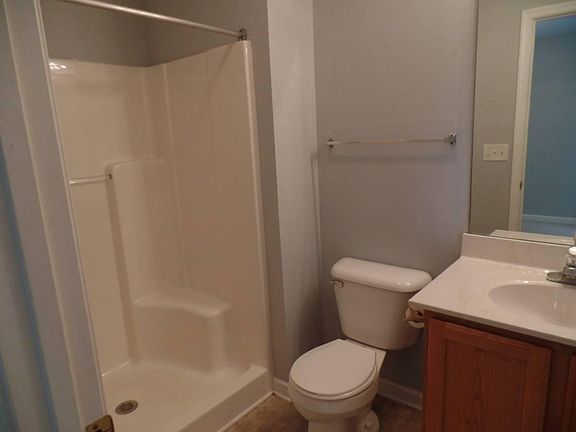 First floor bath attached to office/ bedroom , behind garage