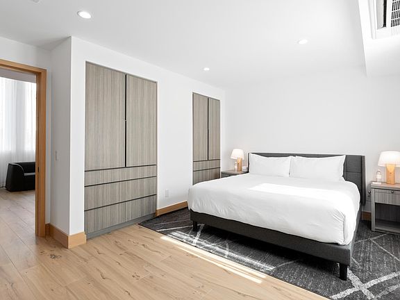 Beds are fully outfitted in luxurious, hotel-grade linens.