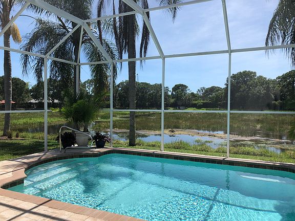 Heated Pool overlooking lake behind. Gorgeous birds and wildlife populate this littoral zone.