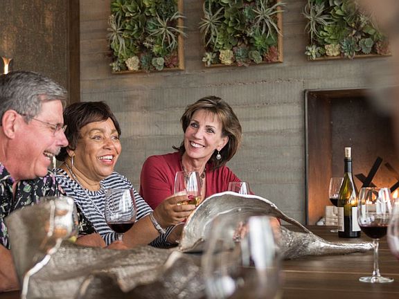 Enjoy a glass of wine with new friends