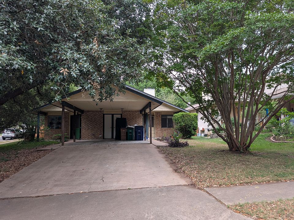 3 bedroom apartment is half this duplex on spacious lot.