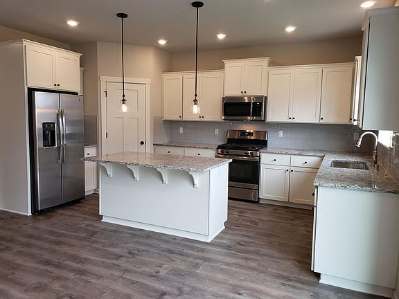 Lots of counter space with corner pantry and plenty of stora