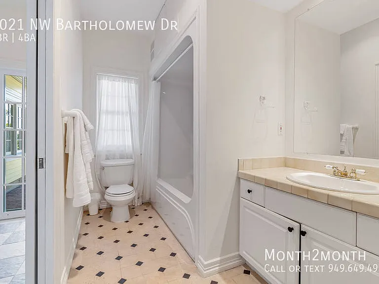 9021 NW Bartholomew Dr — Photo 31