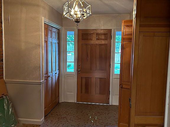 Foyer with coat closet.