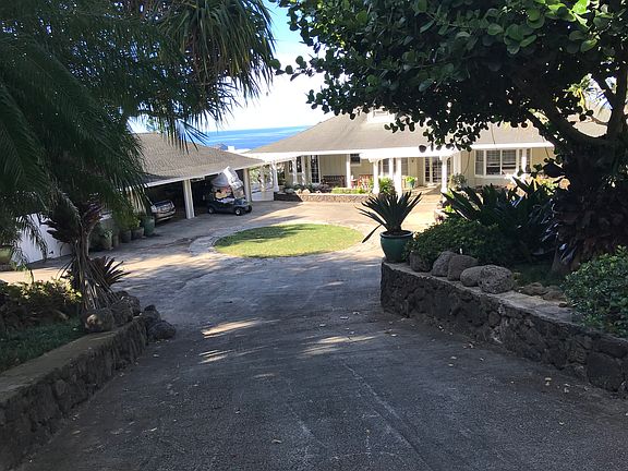 VIEW OF TOP LEVEL OF ESTATE HOME AFTER ENTERING CODED ELECTRONIC GATE
