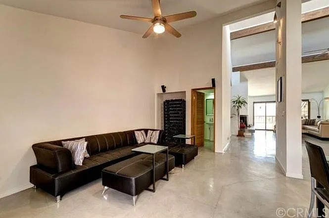Family room next to kitchen, living room, back balcony and t