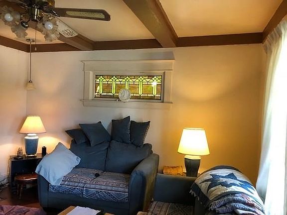 Living Room.  Note the ceiling, window, and ceiling fan.