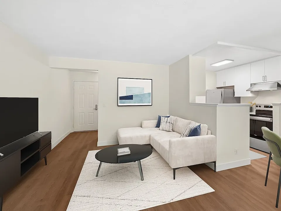 Renovated Package I living room with hard surface flooring