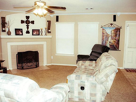 Corner gas log fireplace perfect for cool evenings! Note crown molding.