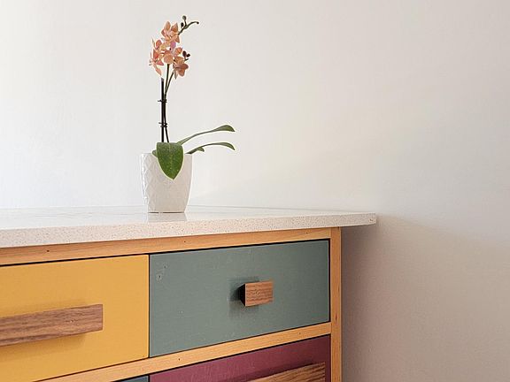 The custom island was made by Los Carpenters and has salvaged doug fir legs and walnut pulls.