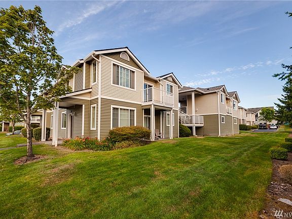 Top floor end unit includes a private balcony