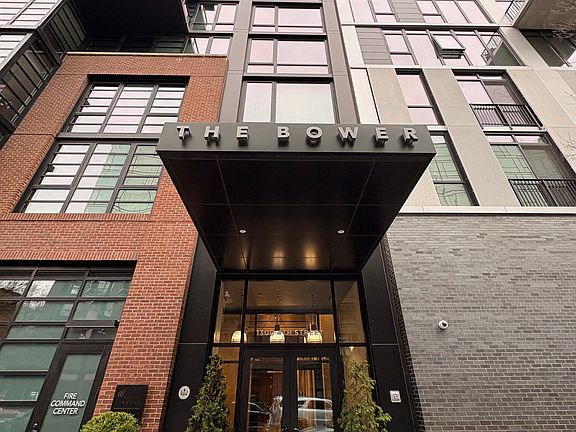 Front door to condo building - secured entrance, elevator and staircase. Only accessible by key fob.