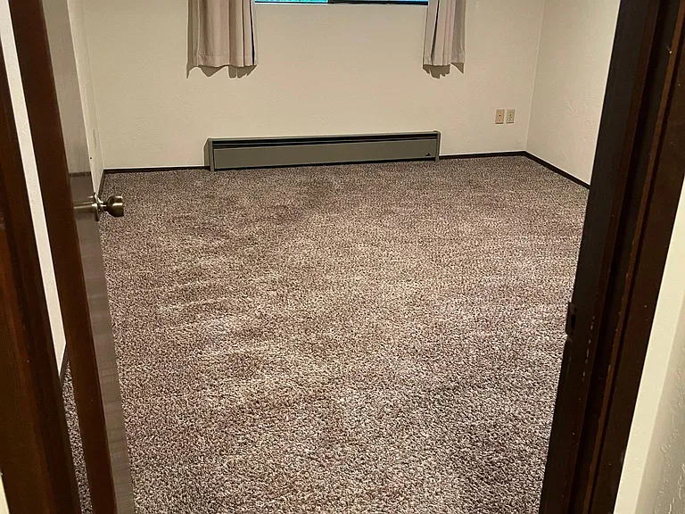 Master bedroom fits King bed. Located at rear of building off patio. Big double door closet. Radiant cozy heat.